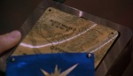 Tia's star case opens up to reveal a map, guiding her and Tony home.
